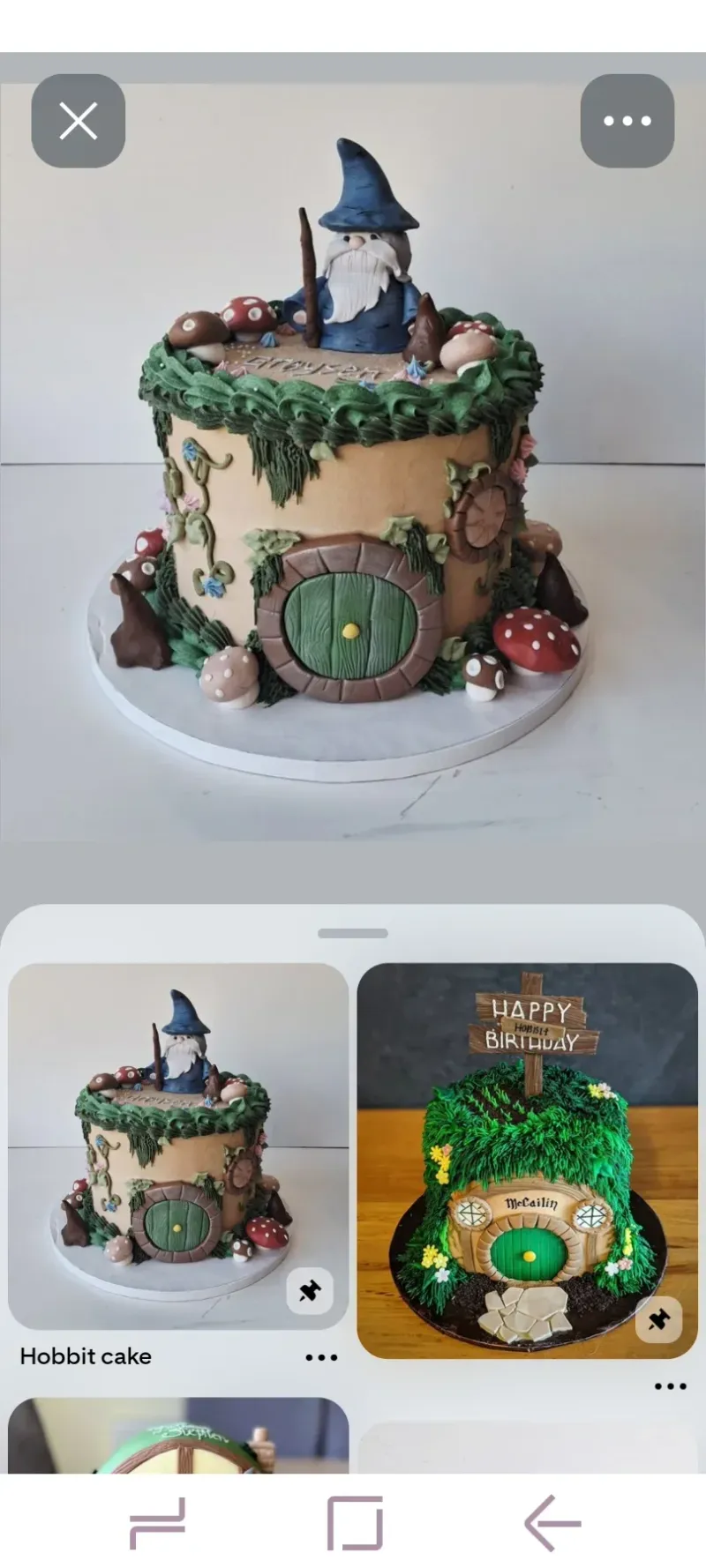 A green and brown 1 Tier cake themed around Hobbit, featuring a wizard figure, house, mushrooms, and grass. A green and brown 1 Tier cake themed around Hobbit, featuring a wizard figure, house, mushrooms, and grass.