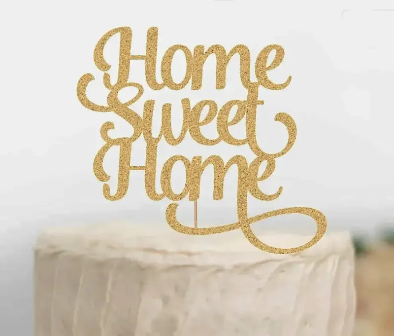 A white 1 Tier cake themed around Home Sweet Home, featuring a gold glitter 'Home Sweet Home' cardstock topper. A white 1 Tier cake themed around Home Sweet Home, featuring a gold glitter 'Home Sweet Home' cardstock topper.