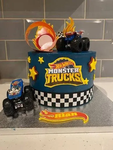 Navy blue 1 tier cake with soft icing, Hot Wheels Monster Truck theme, and plastic monster truck and flame loop toppers Navy blue 1 tier cake with soft icing, Hot Wheels Monster Truck theme, and plastic monster truck and flame loop toppers