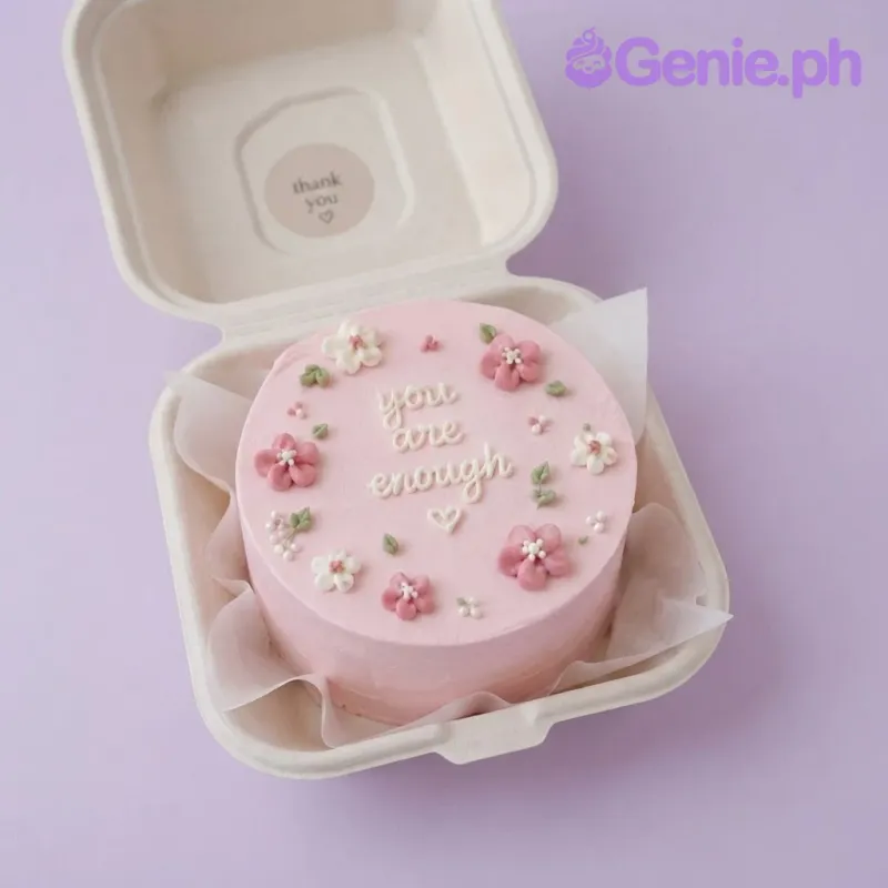 Pink bento cake with soft icing, piped white script message, and handcrafted pink and white fondant flowers Pink bento cake with soft icing, piped white script message, and handcrafted pink and white fondant flowers
