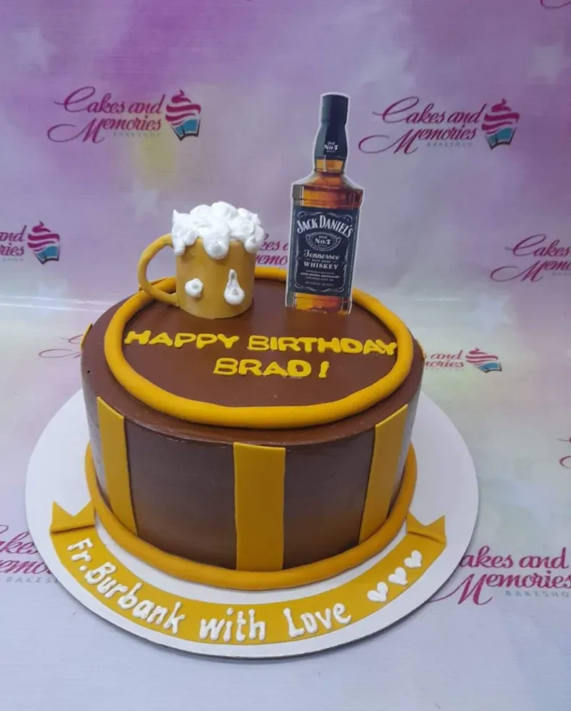 A brown and yellow 1 Tier Fondant cake themed around Jack Daniels Whiskey, featuring a whiskey bottle printout, beer mug, and yellow stripes. A brown and yellow 1 Tier Fondant cake themed around Jack Daniels Whiskey, featuring a whiskey bottle printout, beer mug, and yellow stripes.