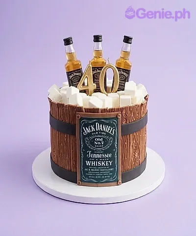 A white and brown 1-Tier Jack Daniels cake with miniature whiskey bottles, gold '40' candles, and marshmallow ice cubes. A white and brown 1-Tier Jack Daniels cake with miniature whiskey bottles, gold '40' candles, and marshmallow ice cubes.