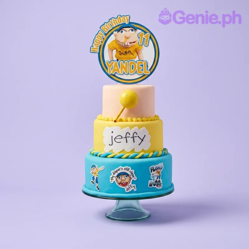A blue, yellow, and peach 3 Tier Fondant cake themed around Jeffy, featuring a circular Jeffy printout and character decals. A blue, yellow, and peach 3 Tier Fondant cake themed around Jeffy, featuring a circular Jeffy printout and character decals.