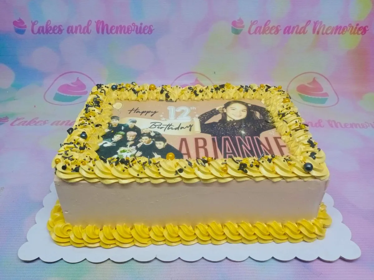 A multi-colored Rectangle cake themed around K-Pop, featuring an edible photo print and icing rosettes with sprinkles. A multi-colored Rectangle cake themed around K-Pop, featuring an edible photo print and icing rosettes with sprinkles.