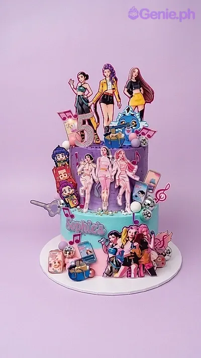 A purple and light blue two-tier K-Pop themed birthday cake featuring K-pop idol printouts, a number 5, and musical notes. A purple and light blue two-tier K-Pop themed birthday cake featuring K-pop idol printouts, a number 5, and musical notes.