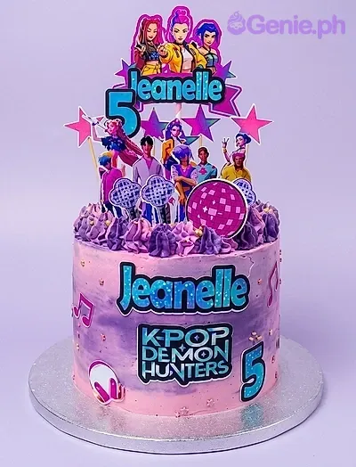 A purple and pink 1 Tier cake themed around K-Pop Demon Hunters, featuring K-Pop characters and musical notes. A purple and pink 1 Tier cake themed around K-Pop Demon Hunters, featuring K-Pop characters and musical notes.
