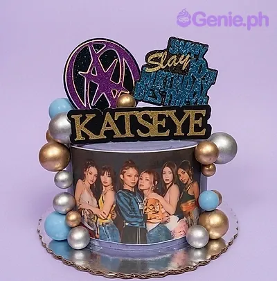 A lavender 1-tier Katseye K-pop themed cake, featuring group photo, logo, 'Slay' text, and gold, silver, blue balls. A lavender 1-tier Katseye K-pop themed cake, featuring group photo, logo, 'Slay' text, and gold, silver, blue balls.