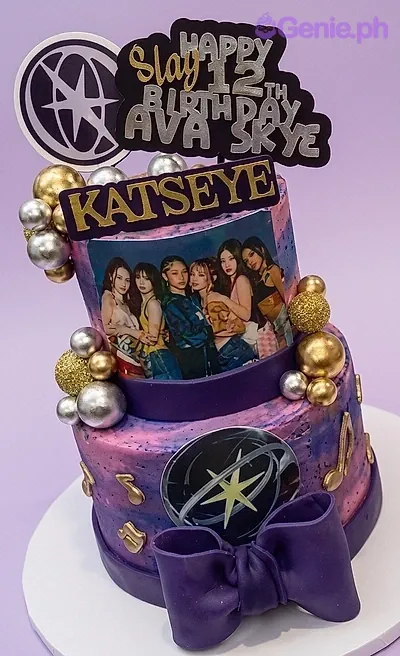 Two-tier purple and pink marble cake with Katseye K-pop group printout and musical note decorations. Two-tier purple and pink marble cake with Katseye K-pop group printout and musical note decorations.