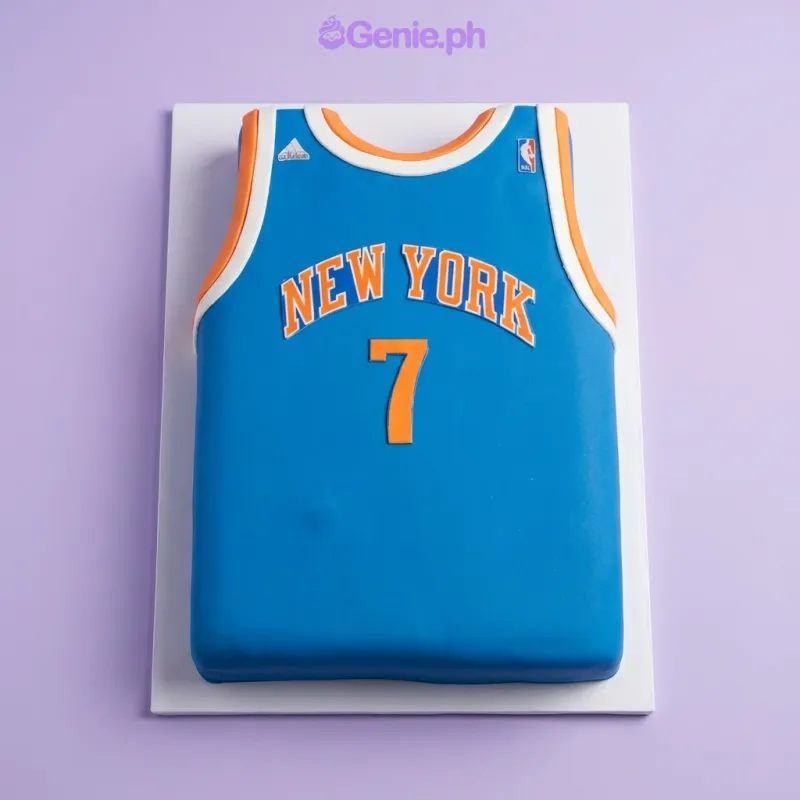Blue rectangle fondant cake shaped like a New York Knicks basketball jersey with orange number 7 and white trim Blue rectangle fondant cake shaped like a New York Knicks basketball jersey with orange number 7 and white trim