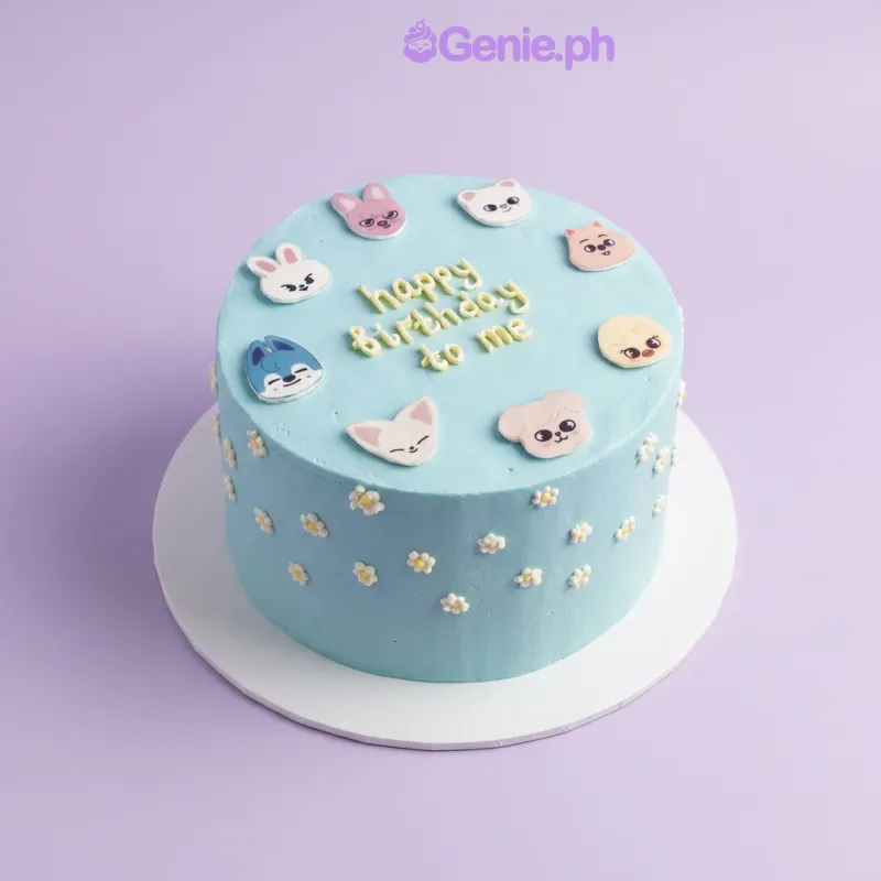 Light blue 1-tier birthday cake with printed character face toppers and piped white flower accents Light blue 1-tier birthday cake with printed character face toppers and piped white flower accents