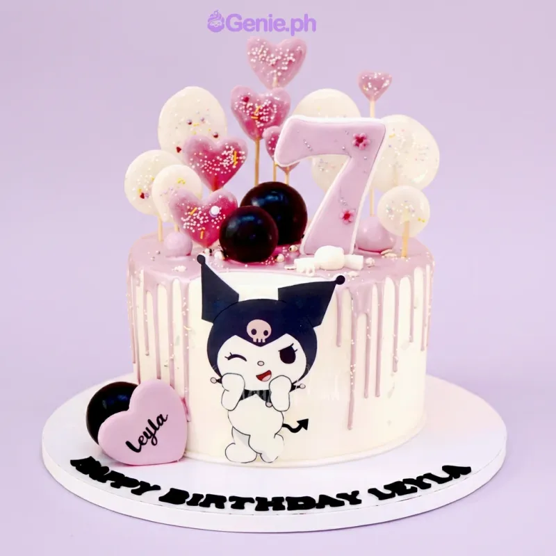 White 1-tier cake with lavender drip, Kuromi character printout, number seven topper, and heart lollipops. White 1-tier cake with lavender drip, Kuromi character printout, number seven topper, and heart lollipops.