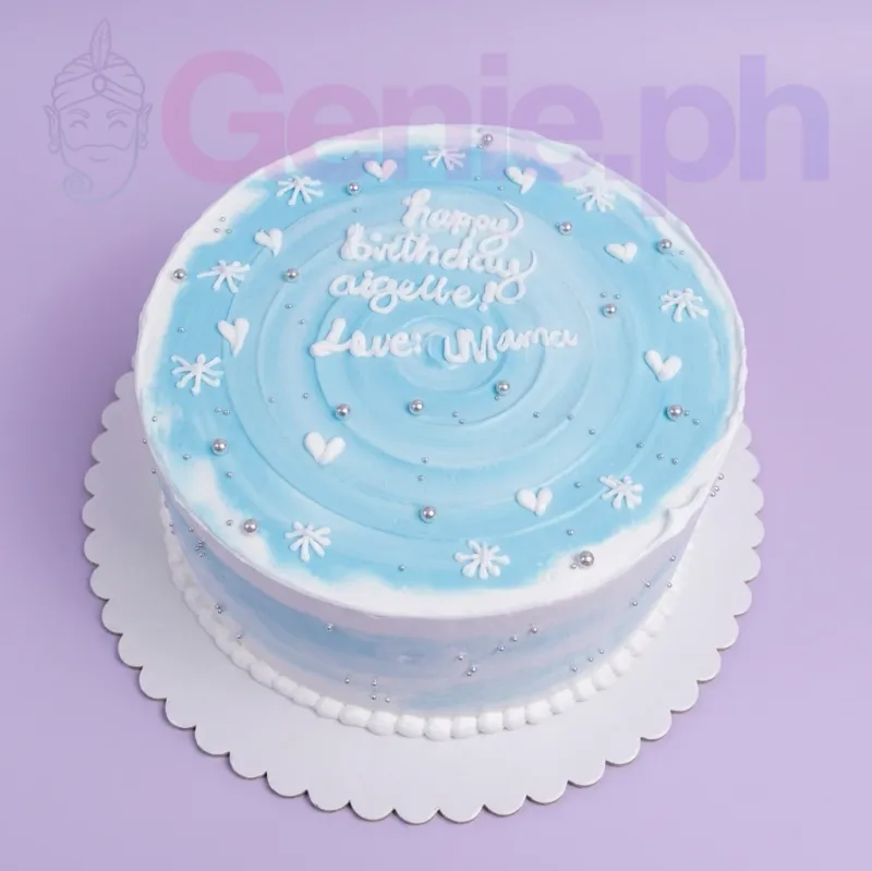 A light blue and white 1-Tier cake themed around minimalist design, featuring piped icing hearts, snowflakes, and silver dragees. A light blue and white 1-Tier cake themed around minimalist design, featuring piped icing hearts, snowflakes, and silver dragees.