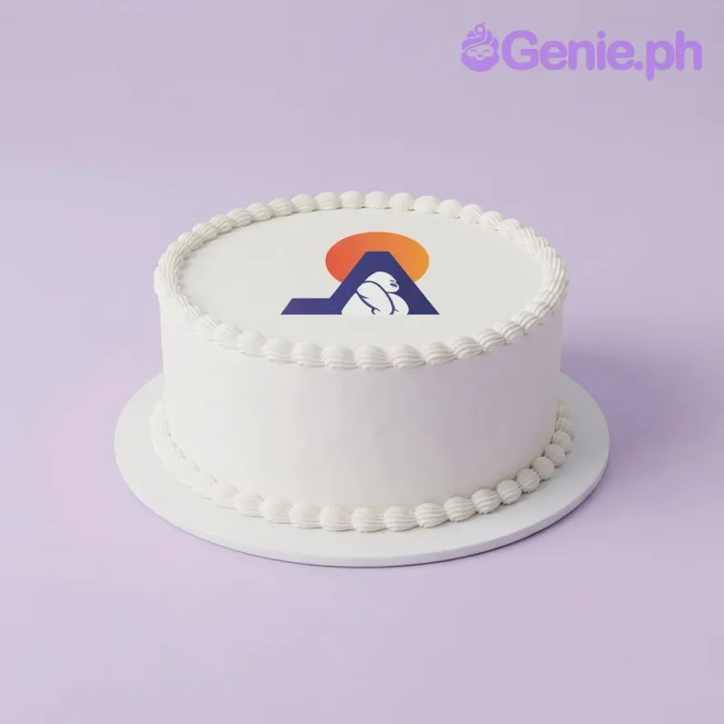 White 1-tier cake with soft icing, edible printed logo image topper, and piped white icing rosette borders White 1-tier cake with soft icing, edible printed logo image topper, and piped white icing rosette borders
