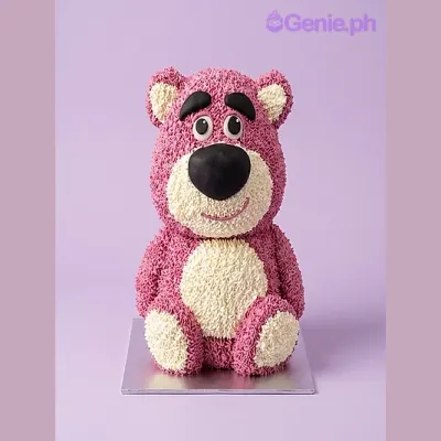 Pink and white bear-shaped cake with piped fur texture and facial features Pink and white bear-shaped cake with piped fur texture and facial features