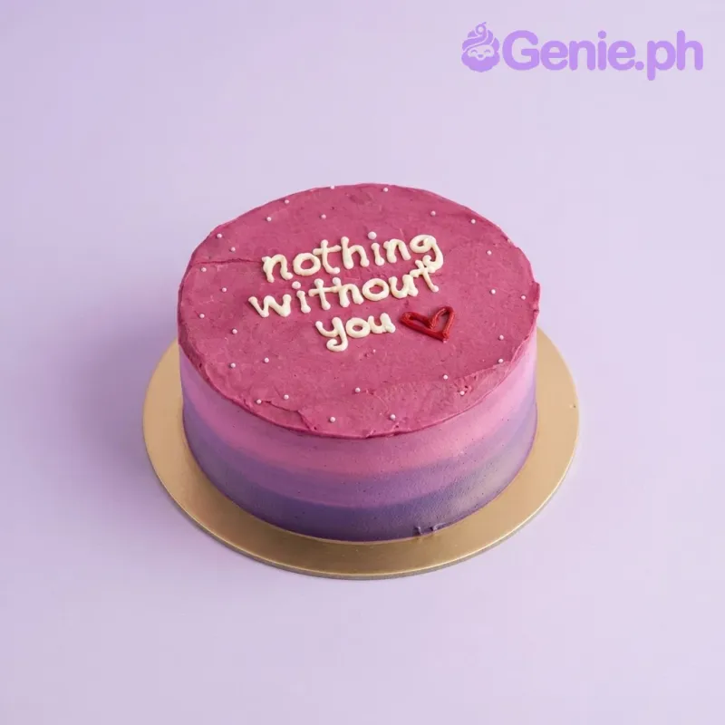 Hot pink 1-tier cake with smooth soft icing, a love quote message, and small piped red heart accents Hot pink 1-tier cake with smooth soft icing, a love quote message, and small piped red heart accents