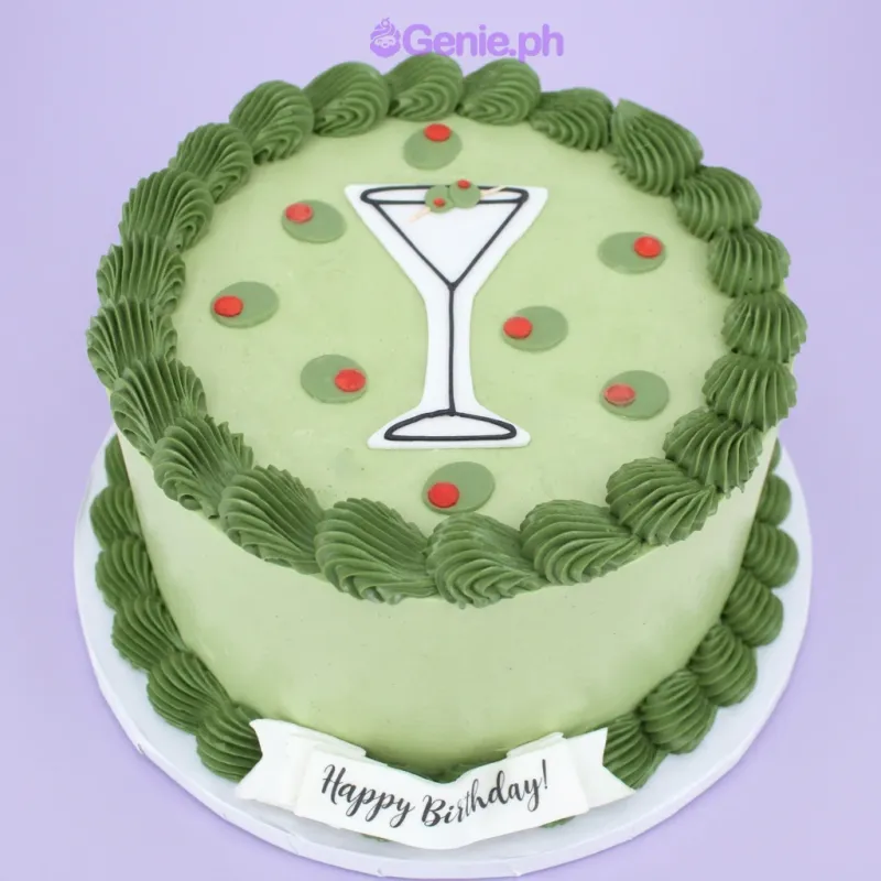 Light green 1-tier birthday cake with a martini glass printout topper and piped green rosette borders Light green 1-tier birthday cake with a martini glass printout topper and piped green rosette borders