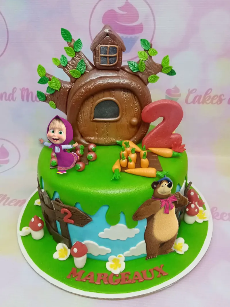 Masha and the Bear themed green fondant cake with a 3D tree house, fondant carrots, and character printouts. Masha and the Bear themed green fondant cake with a 3D tree house, fondant carrots, and character printouts.