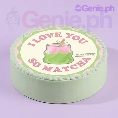 A light green 1 Tier cake themed around Matcha, featuring a large circular matcha drink illustration printout with pink text and a piped icing border. A light green 1 Tier cake themed around Matcha, featuring a large circular matcha drink illustration printout with pink text and a piped icing border.