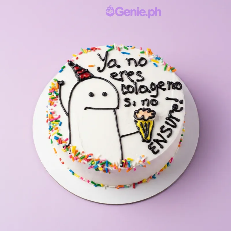 White bento cake with a piped meme character and text saying Ya no eres colageno si no ENSURE with colorful sprinkles White bento cake with a piped meme character and text saying Ya no eres colageno si no ENSURE with colorful sprinkles
