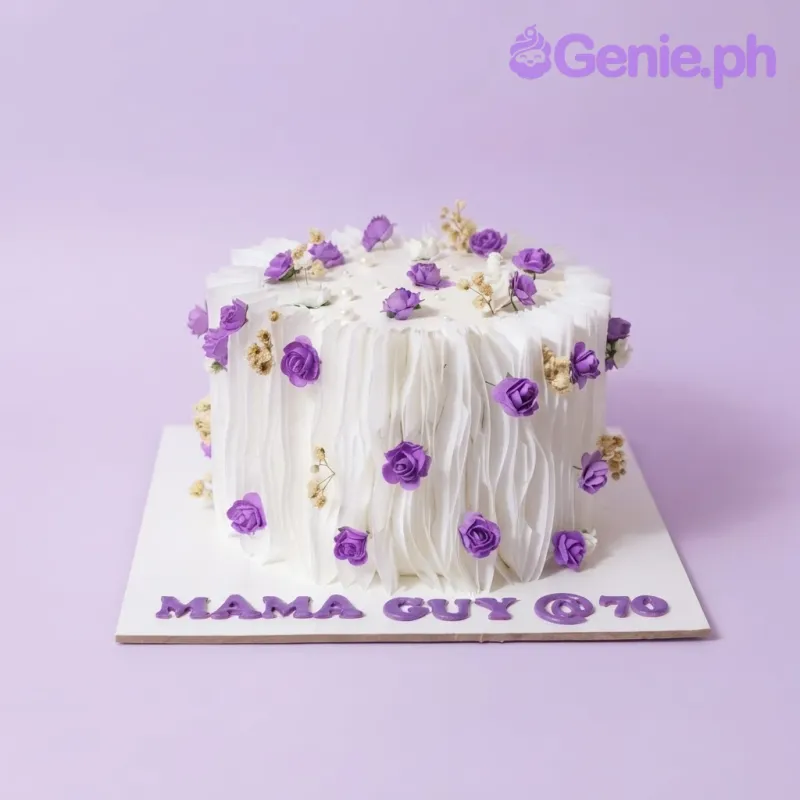 White 1 tier cake with smooth soft icing, purple fondant roses, and scattered sugar pearls White 1 tier cake with smooth soft icing, purple fondant roses, and scattered sugar pearls
