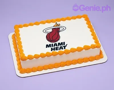 A white and orange Rectangle cake themed around Miami Heat, featuring a Miami Heat logo printout and orange shell-piped borders. A white and orange Rectangle cake themed around Miami Heat, featuring a Miami Heat logo printout and orange shell-piped borders.