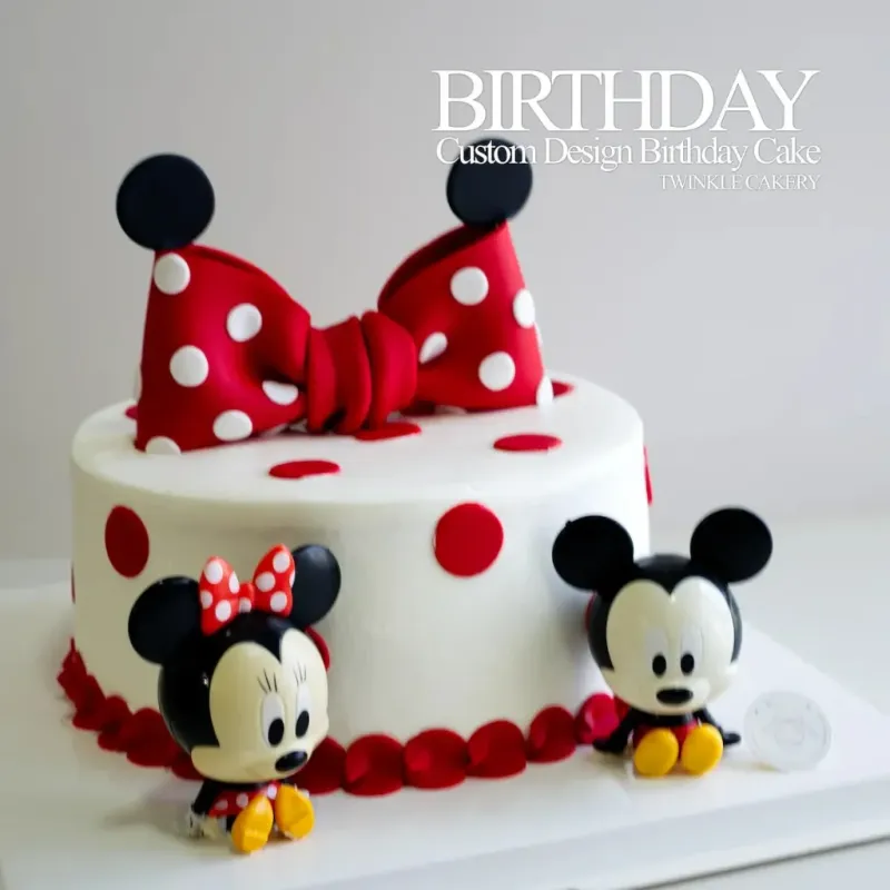 White 1 tier cake with smooth soft icing, Mickey Mouse theme, and plastic Mickey and Minnie Mouse figurines White 1 tier cake with smooth soft icing, Mickey Mouse theme, and plastic Mickey and Minnie Mouse figurines