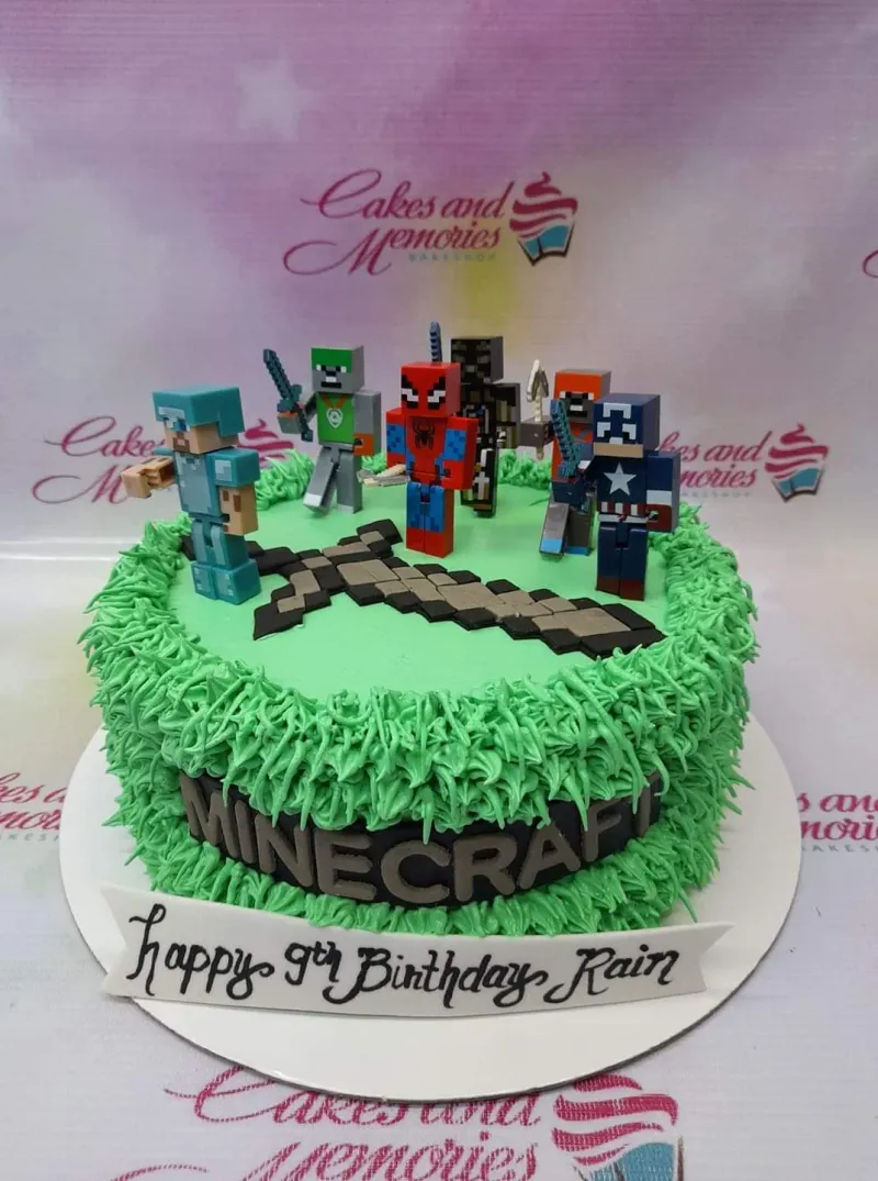 A green 1 Tier cake themed around Minecraft, featuring character toy figurines, an edible pixelated sword, and grass-textured icing. A green 1 Tier cake themed around Minecraft, featuring character toy figurines, an edible pixelated sword, and grass-textured icing.