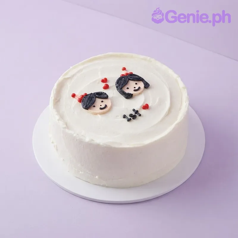 White 1-tier minimalist cake with soft icing, two character face plaques, red hearts, and 1st text White 1-tier minimalist cake with soft icing, two character face plaques, red hearts, and 1st text