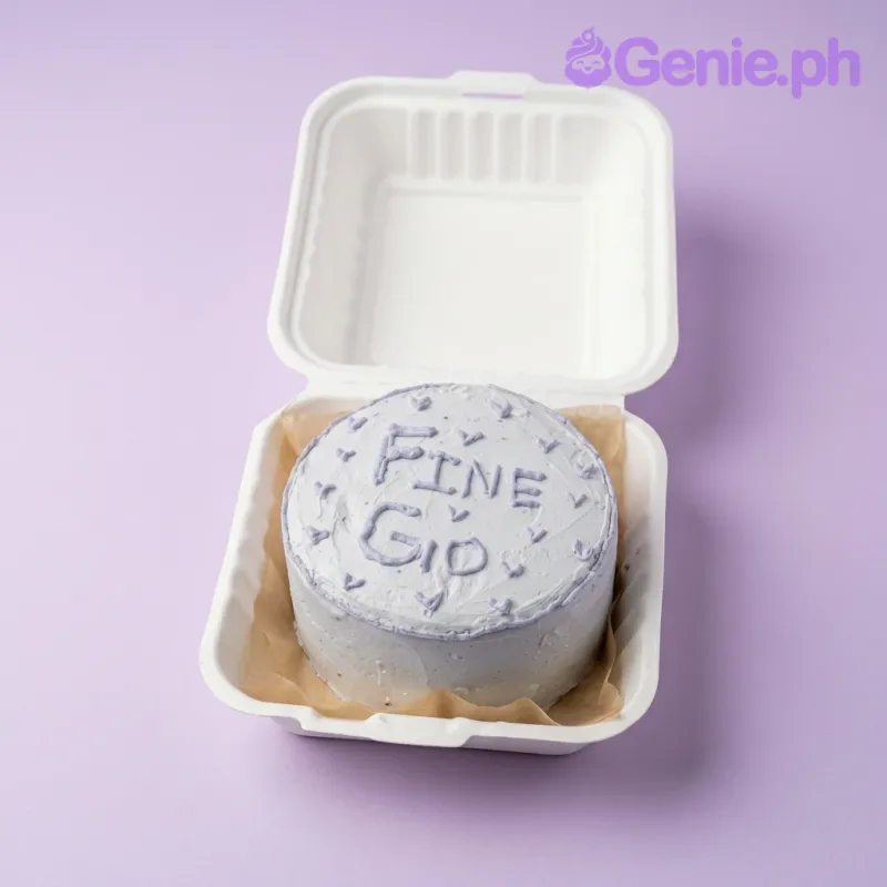 A white Bento cake with a Minimalist Lavender theme, featuring 'FINE GIO' icing text, lavender hearts, and a thin lavender border. A white Bento cake with a Minimalist Lavender theme, featuring 'FINE GIO' icing text, lavender hearts, and a thin lavender border.