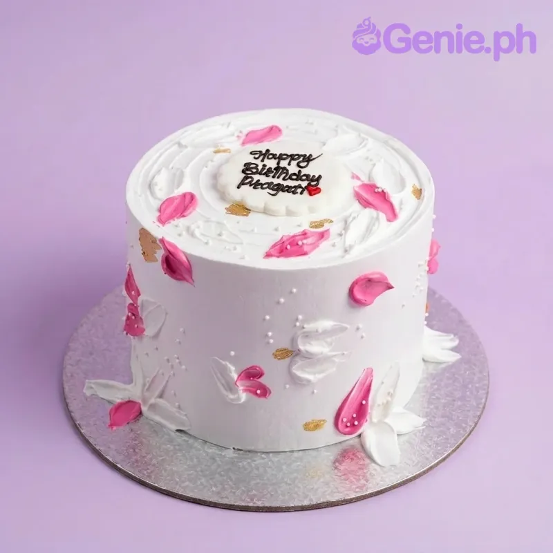 A white 1 Tier Minimalist Pink Petal cake, featuring pink and white petals and gold accents. A white 1 Tier Minimalist Pink Petal cake, featuring pink and white petals and gold accents.