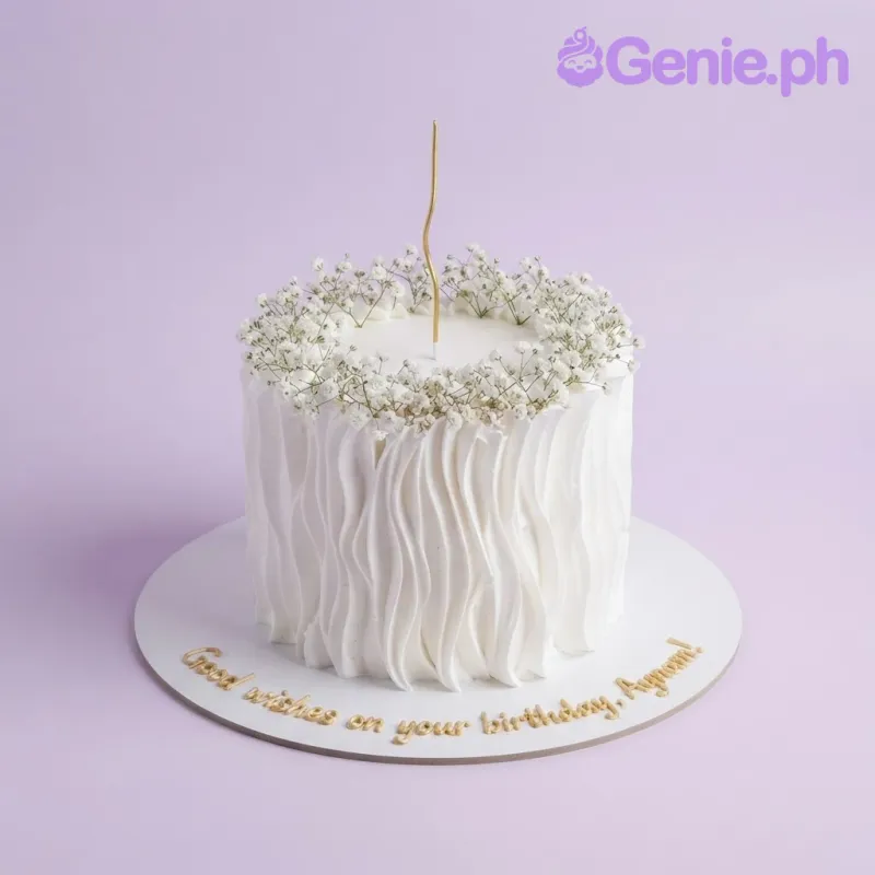 White 1-tier soft icing cake with textured vertical waves, tiny white flowers, and a gold candle White 1-tier soft icing cake with textured vertical waves, tiny white flowers, and a gold candle