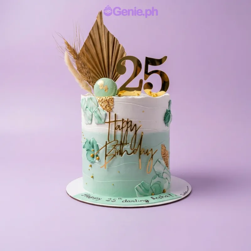 Mint and white gradient cake with gold number 25 and Happy Birthday toppers, dried palm leaves, and a macaron Mint and white gradient cake with gold number 25 and Happy Birthday toppers, dried palm leaves, and a macaron
