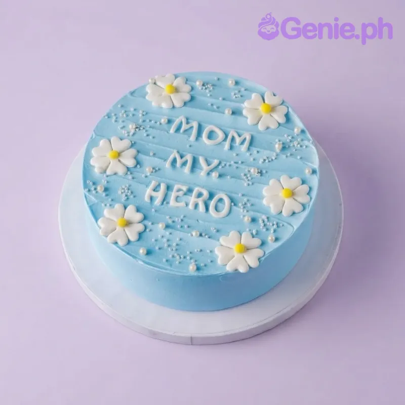 Sky blue 1-tier cake with soft icing, white fondant daisy flowers, and white sugar pearls Sky blue 1-tier cake with soft icing, white fondant daisy flowers, and white sugar pearls