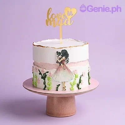White 1 tier cake with gold Love U Maa topper, girl holding pet printout, green vines, and pink flowers White 1 tier cake with gold Love U Maa topper, girl holding pet printout, green vines, and pink flowers