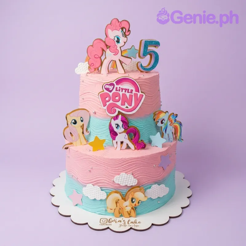 A pink and teal two-tier cake themed around My Little Pony, featuring character printouts and a number five topper. A pink and teal two-tier cake themed around My Little Pony, featuring character printouts and a number five topper.