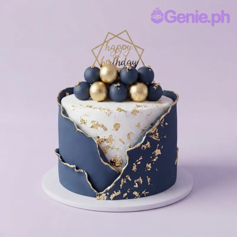 Navy and white fondant cake with gold leaf accents, navy and gold spheres, and a gold happy birthday topper Navy and white fondant cake with gold leaf accents, navy and gold spheres, and a gold happy birthday topper