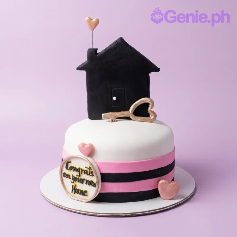 White fondant New Home cake with black and pink stripes, black house topper, gold key, and rose gold hearts. White fondant New Home cake with black and pink stripes, black house topper, gold key, and rose gold hearts.