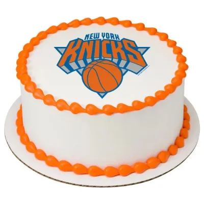A white and orange 1-tier round cake themed around the New York Knicks, featuring an edible logo printout and orange piped borders. A white and orange 1-tier round cake themed around the New York Knicks, featuring an edible logo printout and orange piped borders.