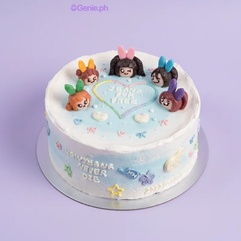 Light blue 1-tier cake with five NewJeans character figures and piped heart message Light blue 1-tier cake with five NewJeans character figures and piped heart message