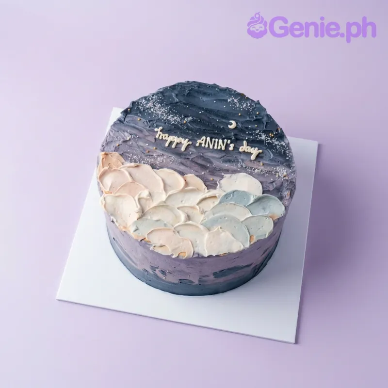 A navy blue 1-tier cake themed Night Sky Minimalist, with a crescent moon, textured peach and mint clouds, and gold dragees. A navy blue 1-tier cake themed Night Sky Minimalist, with a crescent moon, textured peach and mint clouds, and gold dragees.