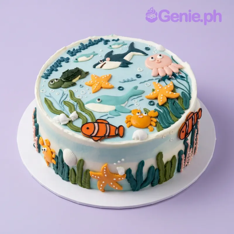 Ocean theme 1 tier cake with shark octopus turtle whale crab clownfish starfish toppers piped seaweed seashells bubbles Ocean theme 1 tier cake with shark octopus turtle whale crab clownfish starfish toppers piped seaweed seashells bubbles