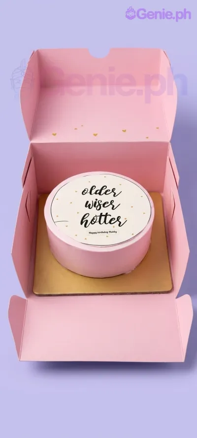 A pink 1-tier cake themed 'Older Wiser Hotter', featuring a circular printout with text, number 5 and 4 candles, and small gold hearts. A pink 1-tier cake themed 'Older Wiser Hotter', featuring a circular printout with text, number 5 and 4 candles, and small gold hearts.
