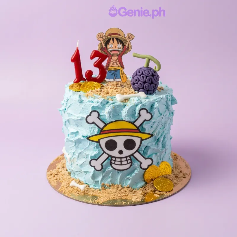 Sky blue 1-tier cake with Luffy, a number 13 candle, a purple devil fruit, a One Piece skull logo, white bones, gold coins, and sand crumbs Sky blue 1-tier cake with Luffy, a number 13 candle, a purple devil fruit, a One Piece skull logo, white bones, gold coins, and sand crumbs