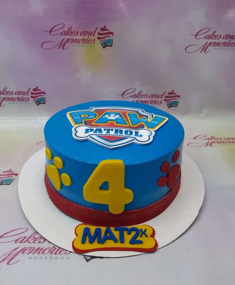 A blue 1 Tier cake themed around Paw Patrol, featuring a large yellow number 4 and red paw prints. A blue 1 Tier cake themed around Paw Patrol, featuring a large yellow number 4 and red paw prints.