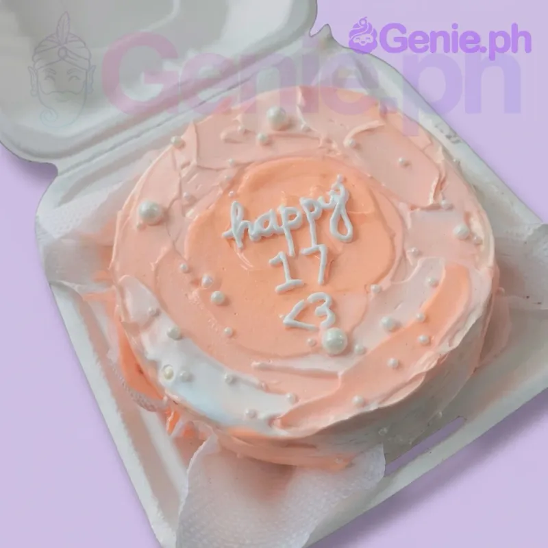 A peach and white bento cake themed for a 17th birthday, featuring palette knife icing, white pearls, and 'happy 17 <3' text. A peach and white bento cake themed for a 17th birthday, featuring palette knife icing, white pearls, and 'happy 17 <3' text.
