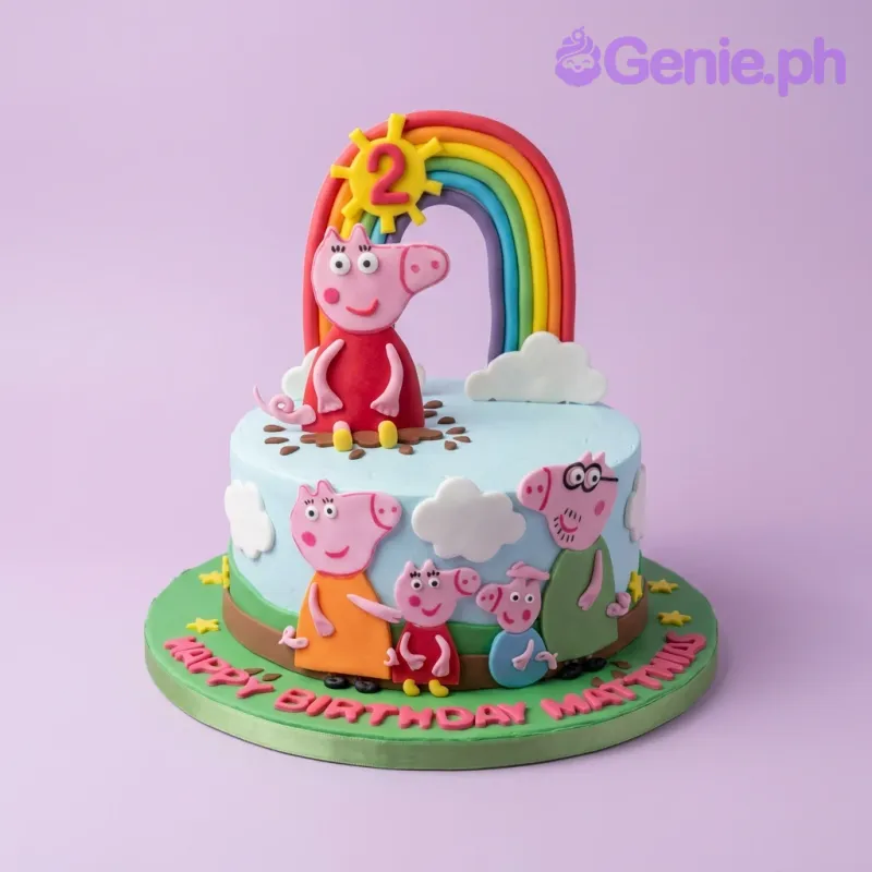 A light blue fondant cake themed around Peppa Pig, featuring Peppa Pig family figures, a rainbow, and a sun, on a green base board. A light blue fondant cake themed around Peppa Pig, featuring Peppa Pig family figures, a rainbow, and a sun, on a green base board.