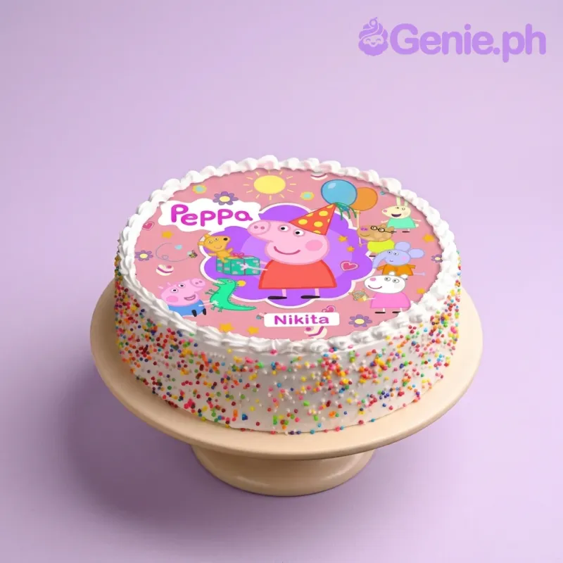 White round cake with Peppa Pig edible print on top and colorful sprinkles on the sides. White round cake with Peppa Pig edible print on top and colorful sprinkles on the sides.