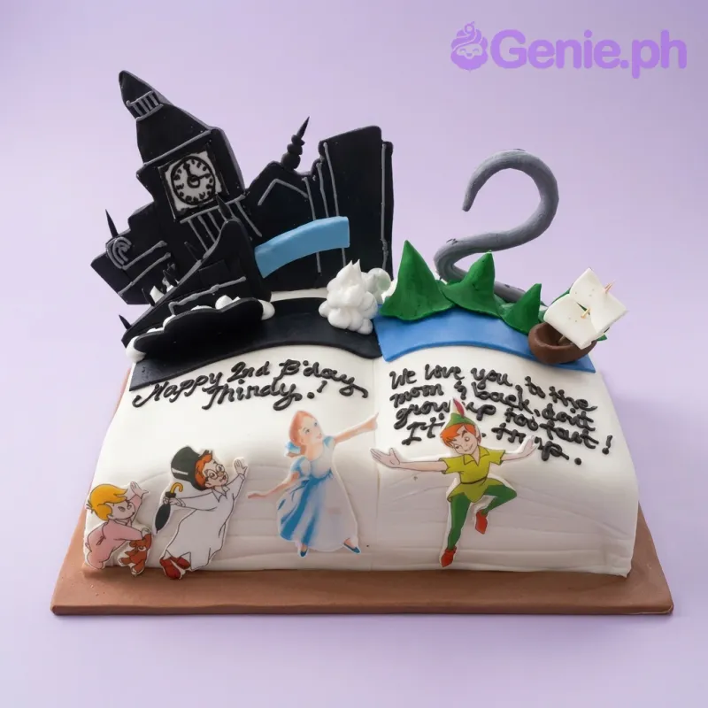 A white square fondant Peter Pan cake, featuring Peter Pan, Wendy, Big Ben, and Neverland accents. A white square fondant Peter Pan cake, featuring Peter Pan, Wendy, Big Ben, and Neverland accents.