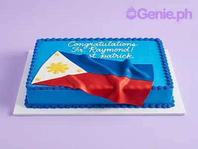 Blue rectangular cake with a large fondant Philippine flag draped over the top and white piped congratulatory text Blue rectangular cake with a large fondant Philippine flag draped over the top and white piped congratulatory text