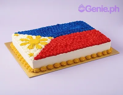 Rectangular cake with white, blue, and red piped rosettes forming the Philippine flag design, featuring a yellow sun and stars. Rectangular cake with white, blue, and red piped rosettes forming the Philippine flag design, featuring a yellow sun and stars.